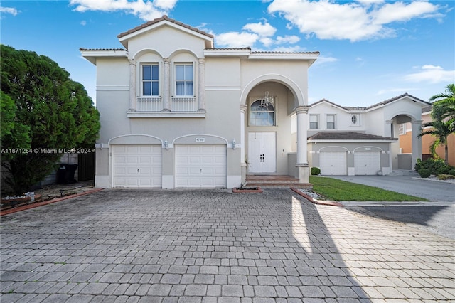 mediterranean / spanish house featuring a garage