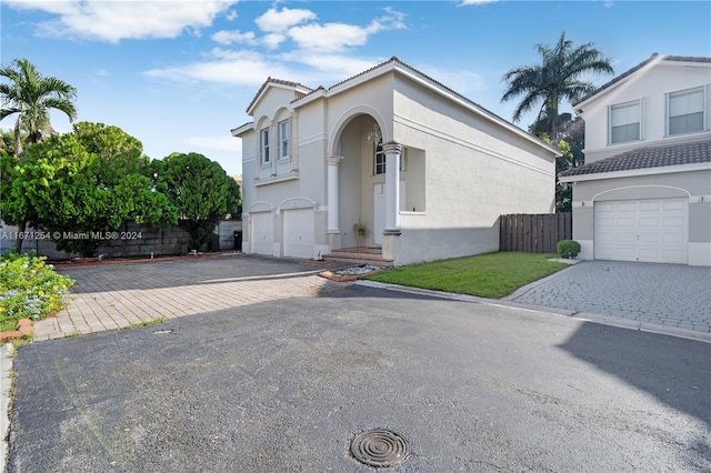 front of property with a garage