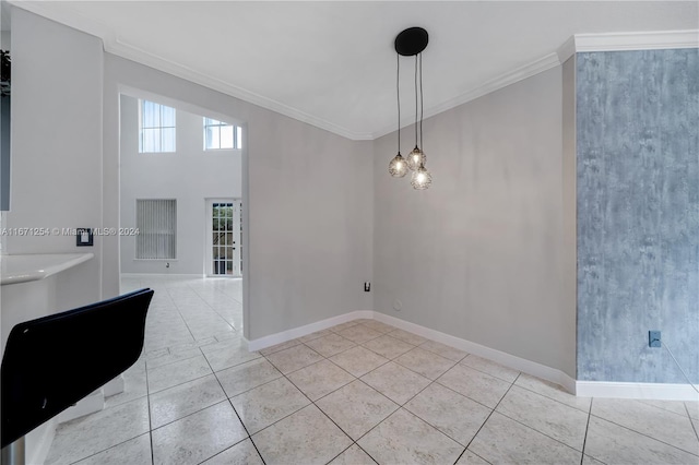 unfurnished dining area featuring ornamental molding and light tile patterned floors