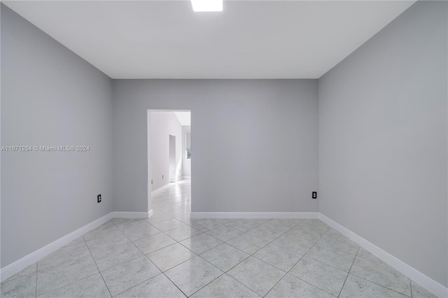 spare room with light tile patterned floors