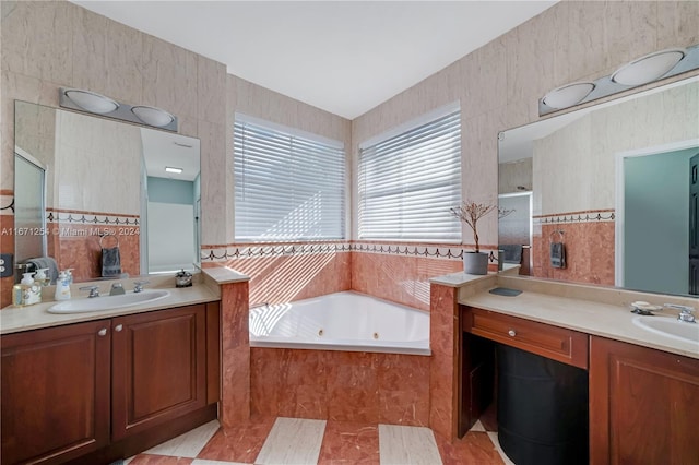 bathroom with vanity, tile patterned floors, tile walls, and plus walk in shower