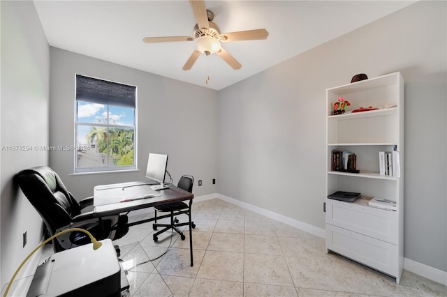 office area with light tile patterned floors and ceiling fan