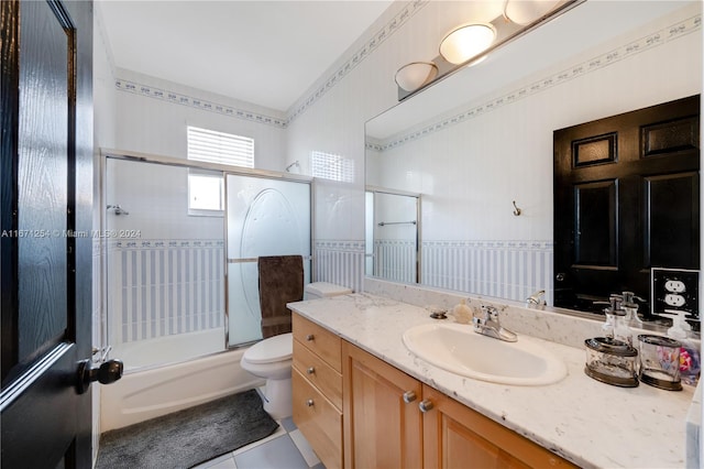 full bathroom with toilet, enclosed tub / shower combo, vanity, and tile patterned floors