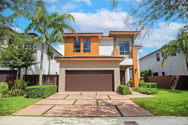 contemporary house with a front lawn and a garage