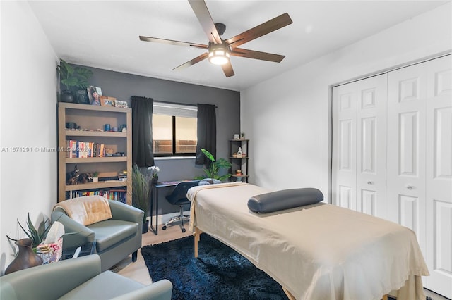 bedroom featuring ceiling fan and a closet