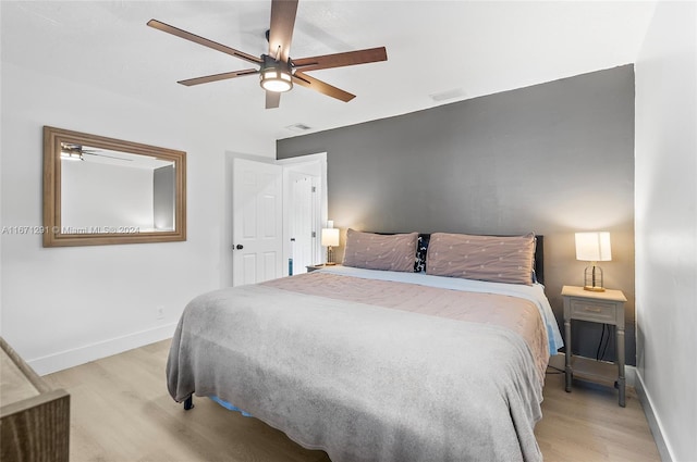 bedroom featuring light wood-type flooring and ceiling fan