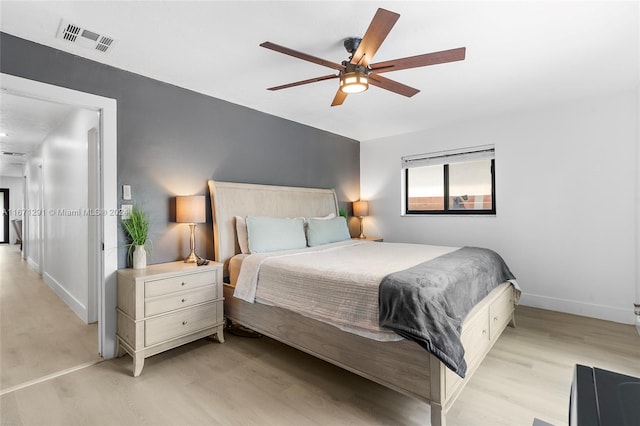 bedroom featuring light hardwood / wood-style floors and ceiling fan