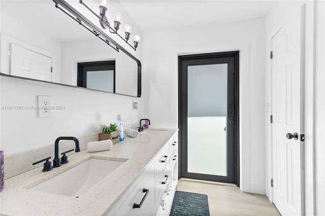 bathroom featuring vanity and hardwood / wood-style flooring