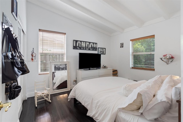 bedroom with lofted ceiling with beams, dark hardwood / wood-style flooring, and multiple windows