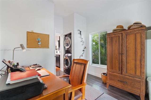 office space featuring stacked washer / dryer and dark hardwood / wood-style flooring