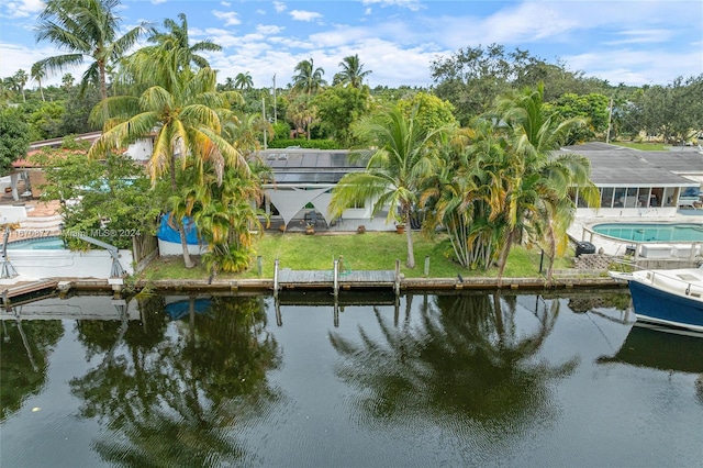 birds eye view of property with a water view