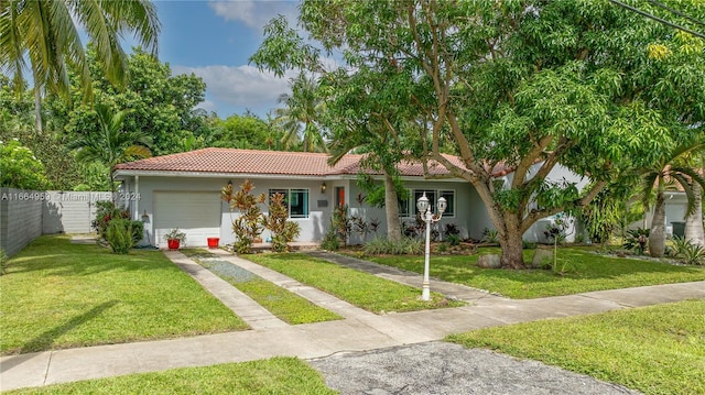 view of front facade featuring a garage and a front lawn