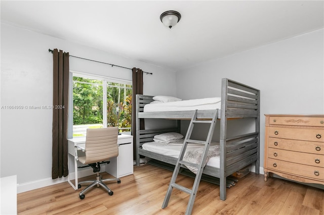 bedroom featuring wood-type flooring