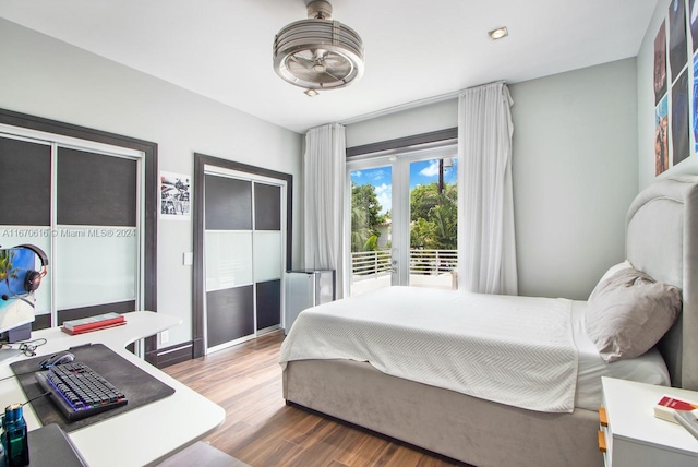 bedroom with hardwood / wood-style flooring