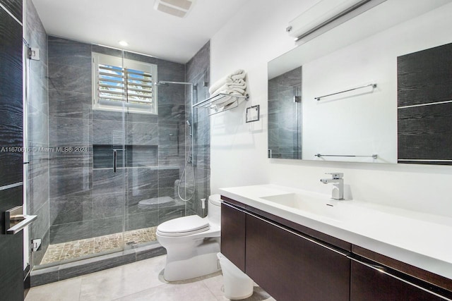 2382 Alton Rd, Miami Beach, FL 33140 - bathroom featuring toilet, vanity, a shower stall, and tile patterned floors