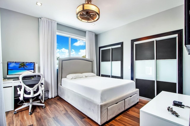 2382 Alton Rd, Miami Beach, FL 33140 - bedroom with dark wood-type flooring and multiple closets