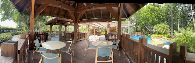 exterior space featuring a gazebo and a swimming pool side deck