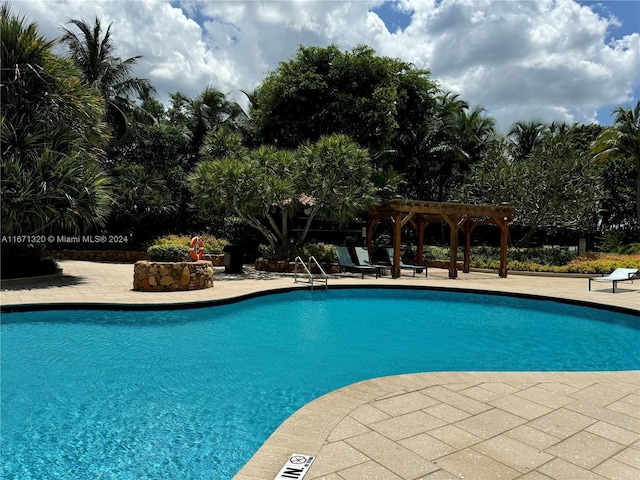 view of swimming pool with a pergola and a patio area