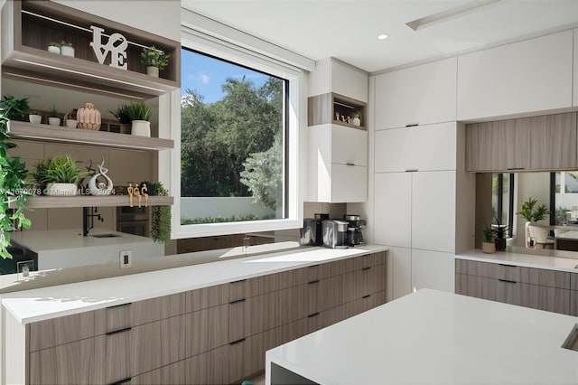 kitchen featuring white cabinets