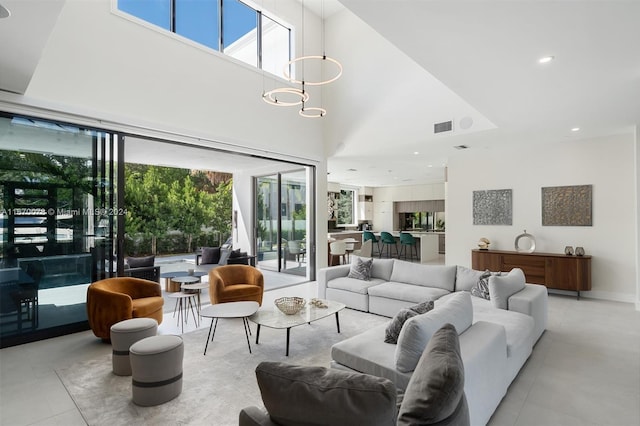 living room featuring a towering ceiling