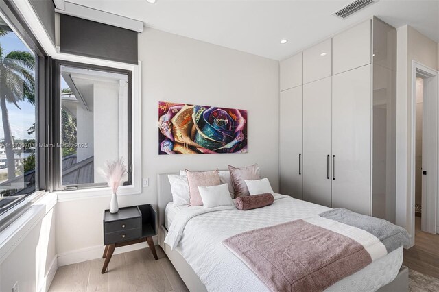 bedroom featuring hardwood / wood-style floors