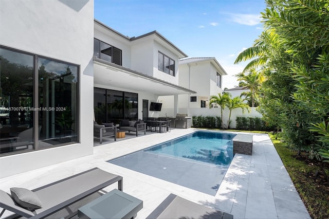 view of swimming pool featuring a patio and outdoor lounge area