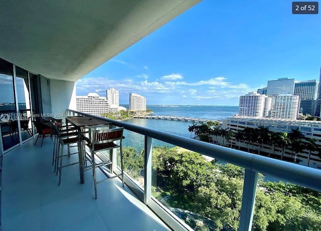 balcony featuring a water view