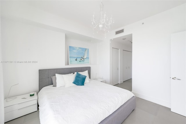 bedroom with a chandelier