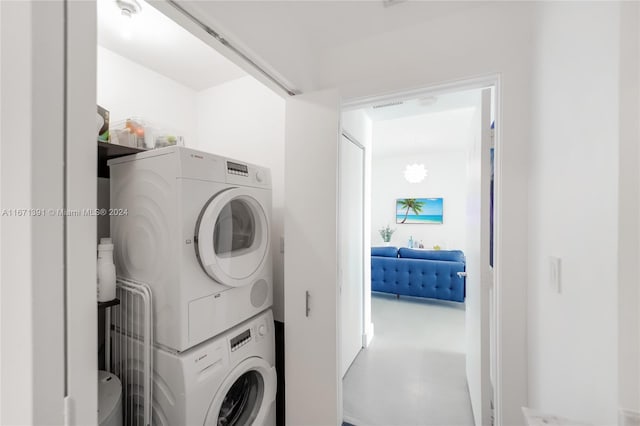 laundry room featuring stacked washer / dryer