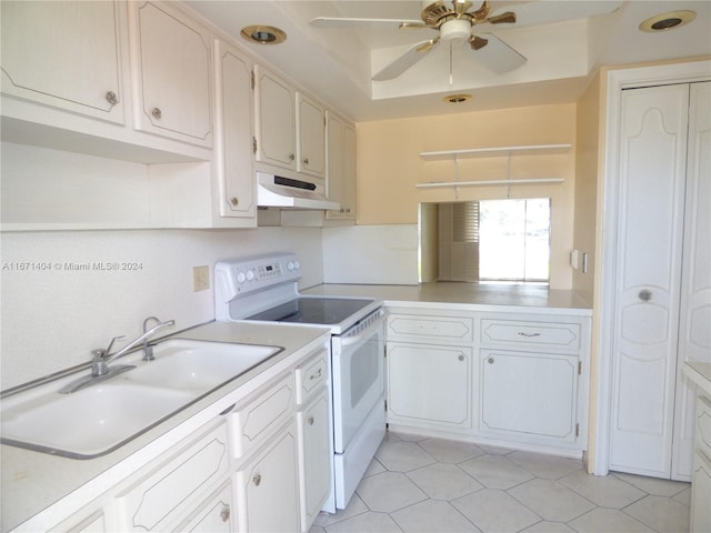 kitchen featuring ceiling fan, white cabinets, white electric range oven, and sink