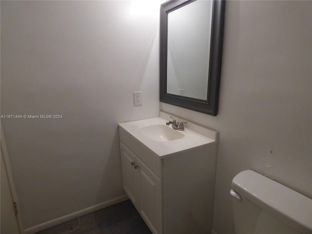 bathroom with vanity and toilet