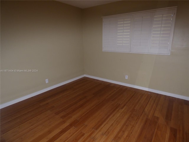 spare room featuring hardwood / wood-style flooring