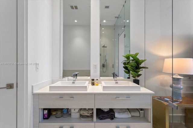 bathroom featuring vanity and an enclosed shower