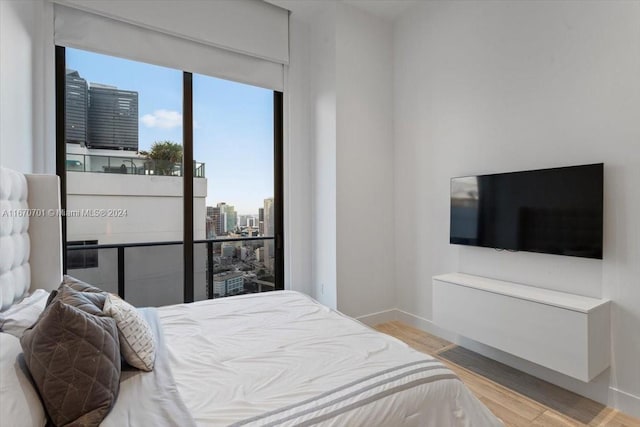 bedroom with light wood-type flooring