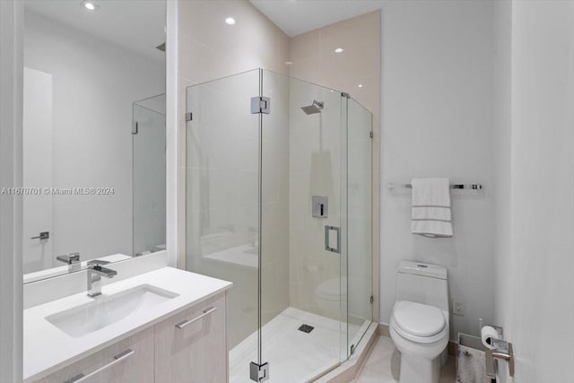 bathroom with walk in shower, vanity, and toilet