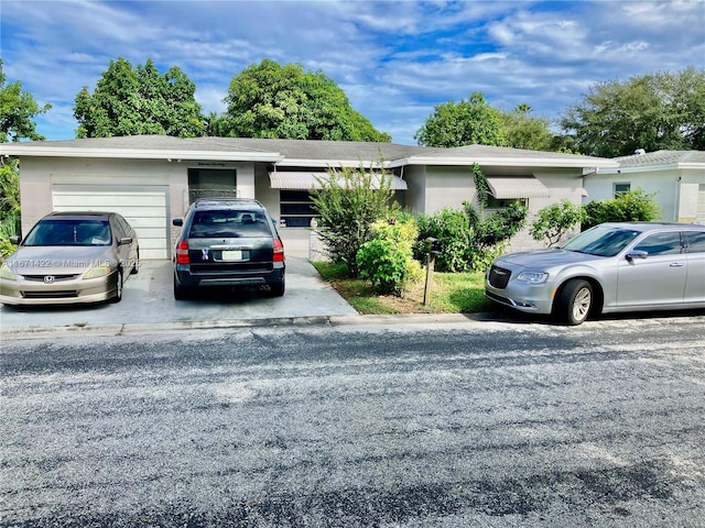 single story home with a garage