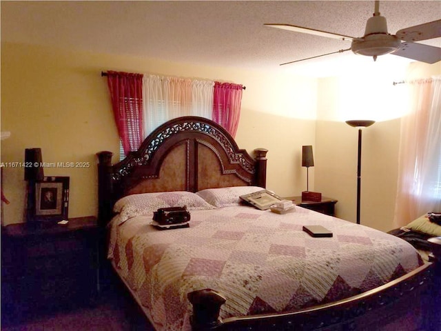 bedroom featuring a textured ceiling and ceiling fan