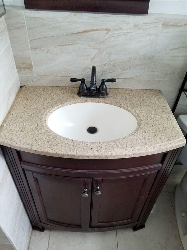 bathroom featuring tile patterned flooring and vanity