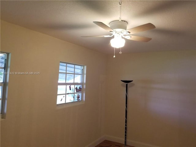 unfurnished room featuring ceiling fan