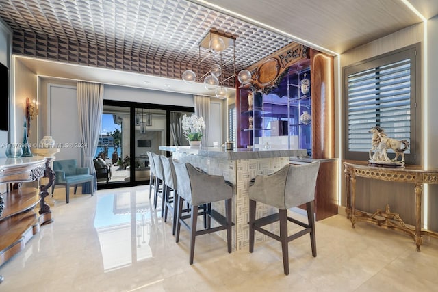 dining space featuring bar and a wealth of natural light