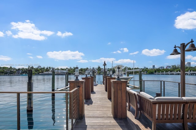 view of dock with a water view and boat lift