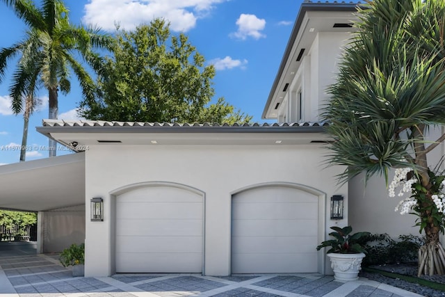 garage with a carport