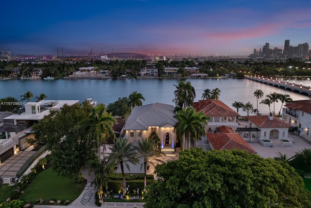 aerial view at dusk with a water view