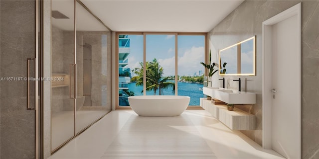 bathroom featuring independent shower and bath, floor to ceiling windows, and sink