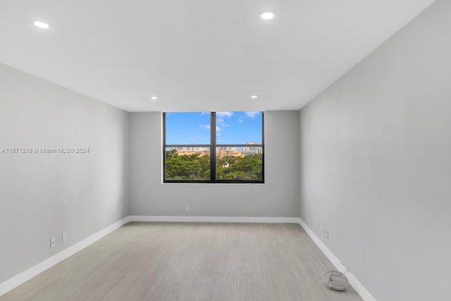 spare room featuring light hardwood / wood-style floors