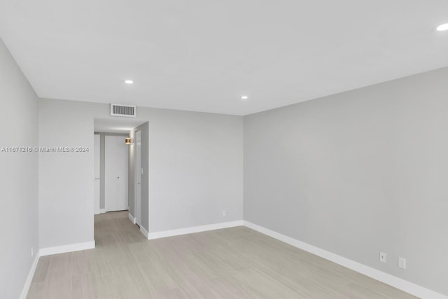 unfurnished room featuring light hardwood / wood-style flooring