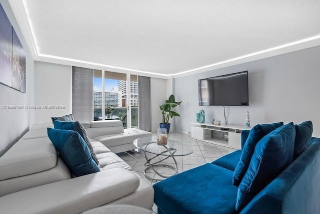living area featuring expansive windows and light tile patterned floors