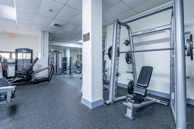 workout area featuring a paneled ceiling