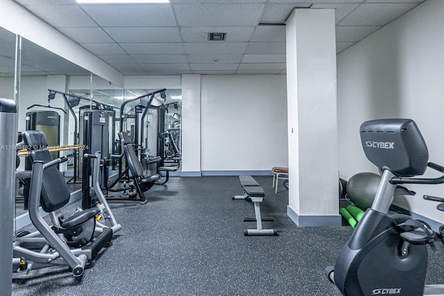 workout area featuring a drop ceiling