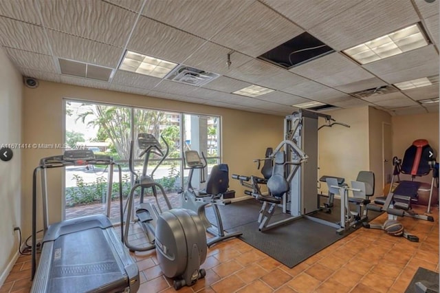 workout area with tile patterned flooring